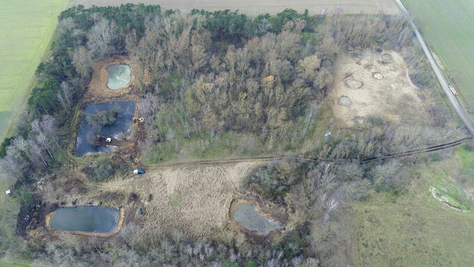 Restored amphibian waterbodies in the former gravel pit in Wackerwinkel, photographed from the air